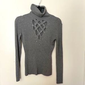 Cache long sleeve turtleneck sweater with criss cross and rhinestone detailing